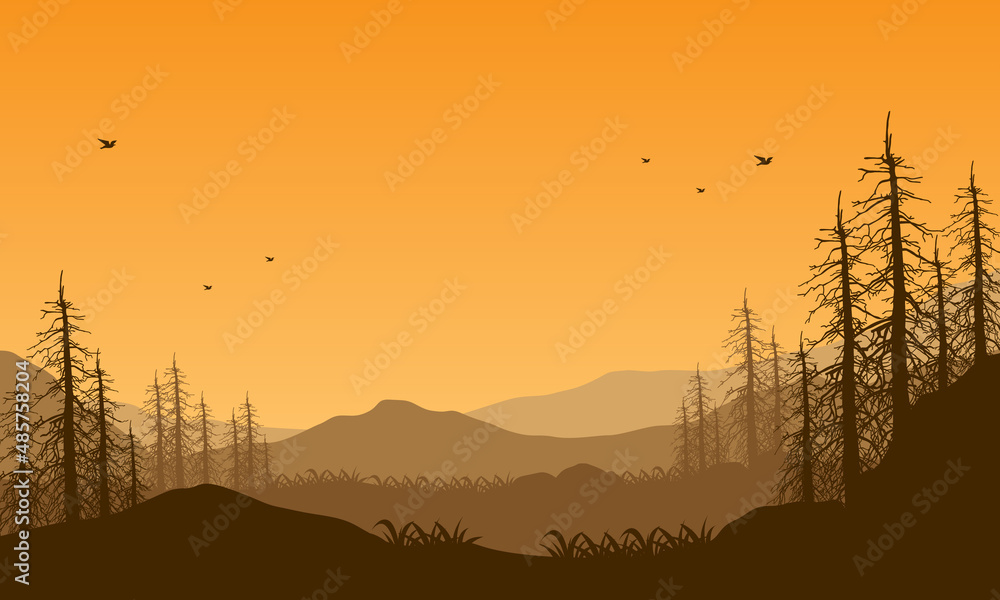 Fototapeta premium Beautiful mountain panorama at dusk from outside the city with aesthetic dry tree silhouette