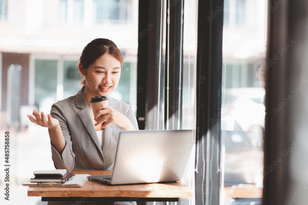 Young asian woman confident working at home with laptop computer and thinking idea for planning, freelance happy girl excited and success using notebook thoughtful and writing, business concept. Young asian woman confident working at home with laptop computer and thinking idea for planning, freelance happy girl excited and success using notebook thoughtful and writing, business concept.