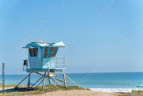 Light blue lifeguard house on the beach at San Clemente, California © Jason