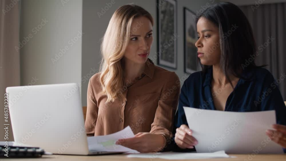 Two women working together at home office . Shot with RED helium camera in 8K. Two women working together at home office . Shot with RED helium camera in 8K.