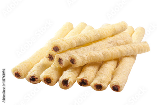 Airy crunchy corn sticks with chocolate and nut filling isolated on white