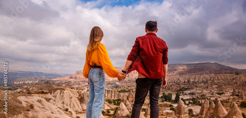 Young couple on hill in Cappadocia photo
