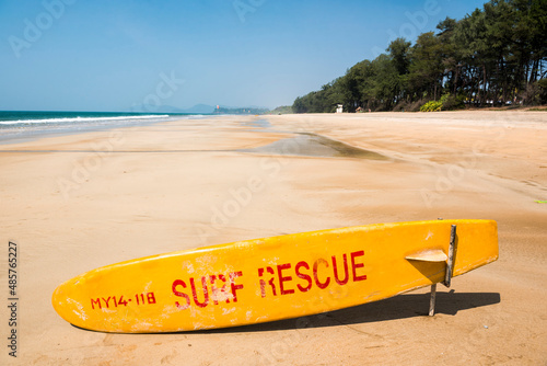 Photography Surf rescue life saving surfing board on tropical Galgibag Beach with white sand