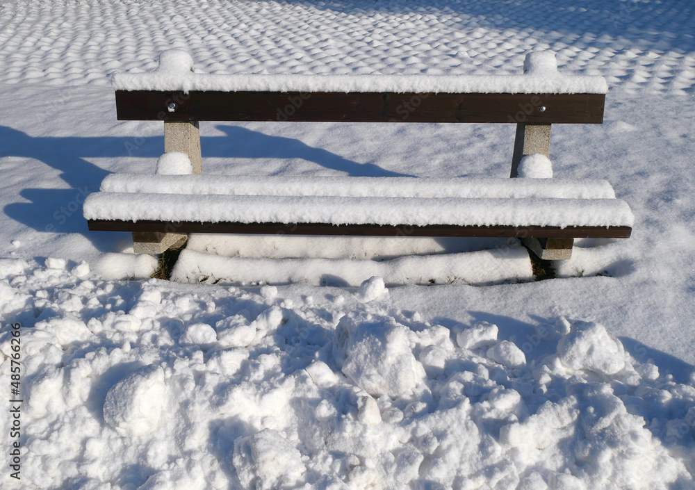 Bench in the park in winter time