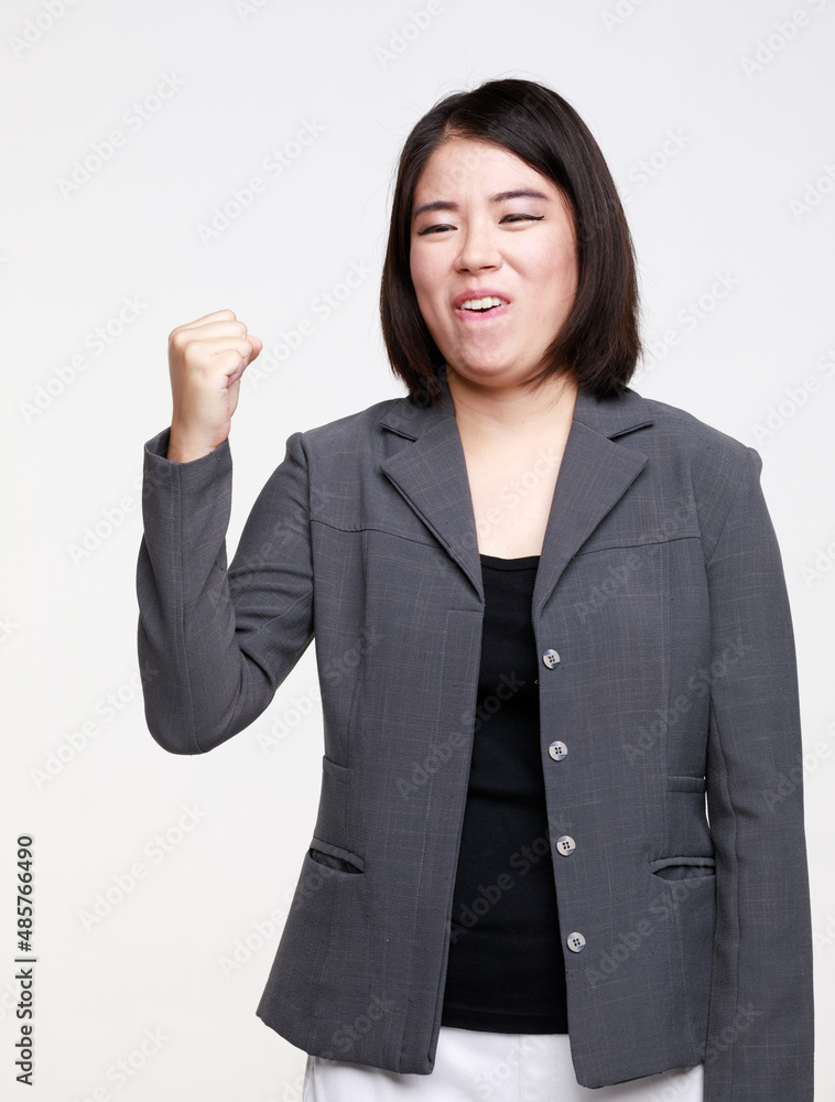 Portrait studio isolated cutout closeup shot of Asian young happy professional successful female businesswoman in formal suit jacket smiling look at camera holding hand pointing on white background Portrait studio isolated cutout closeup shot of Asian young happy professional successful female businesswoman in formal suit jacket smiling look at camera holding hand pointing on white background