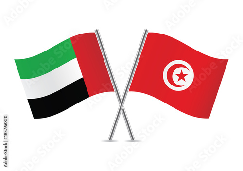 The United Arab Emirates and Tunisia crossed flags. UAE and Tunisian flags isolated on white background. Vector illustration.