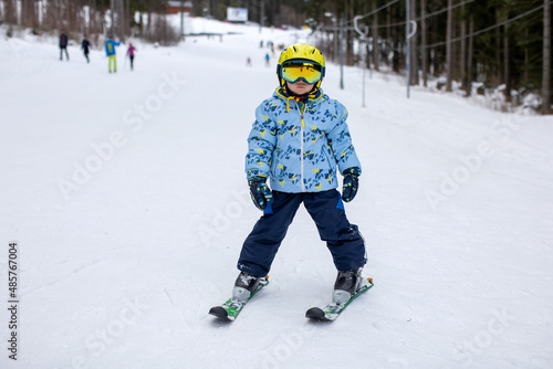 Little toddler boy, preschool child, skiing for the first time