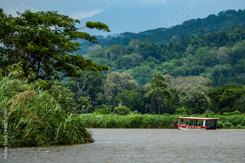 Tourist boat trip on the Tarcoles River, Carara National Park, Puntarenas Province, Costa Rica photo