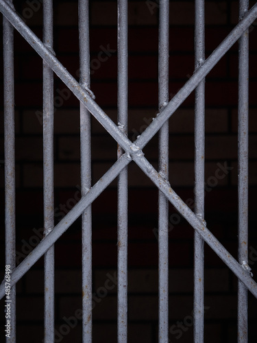 Texture of a gray metal grate with various elements