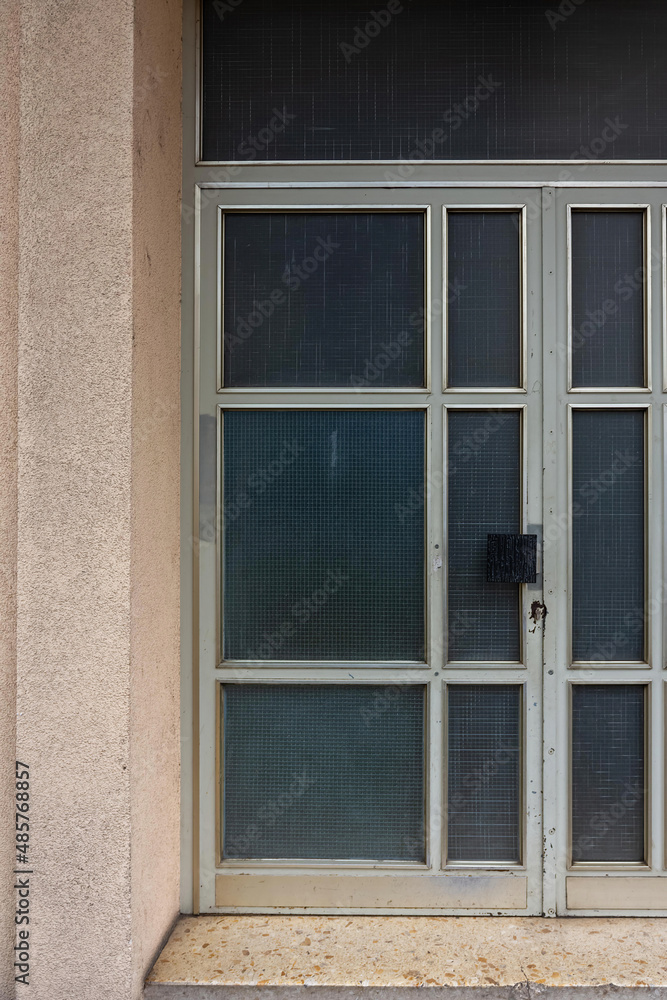 Recessed building window with white metal frame Recessed building window with white metal frame