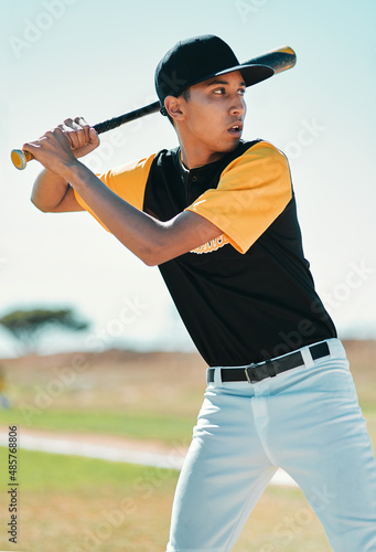 It aint over til its over. Shot of a baseball player swinging his bat while out on the pitch.