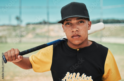 Ill show you how to win a game. Shot of a young baseball player holding a baseball bat while posing outside on the pitch.