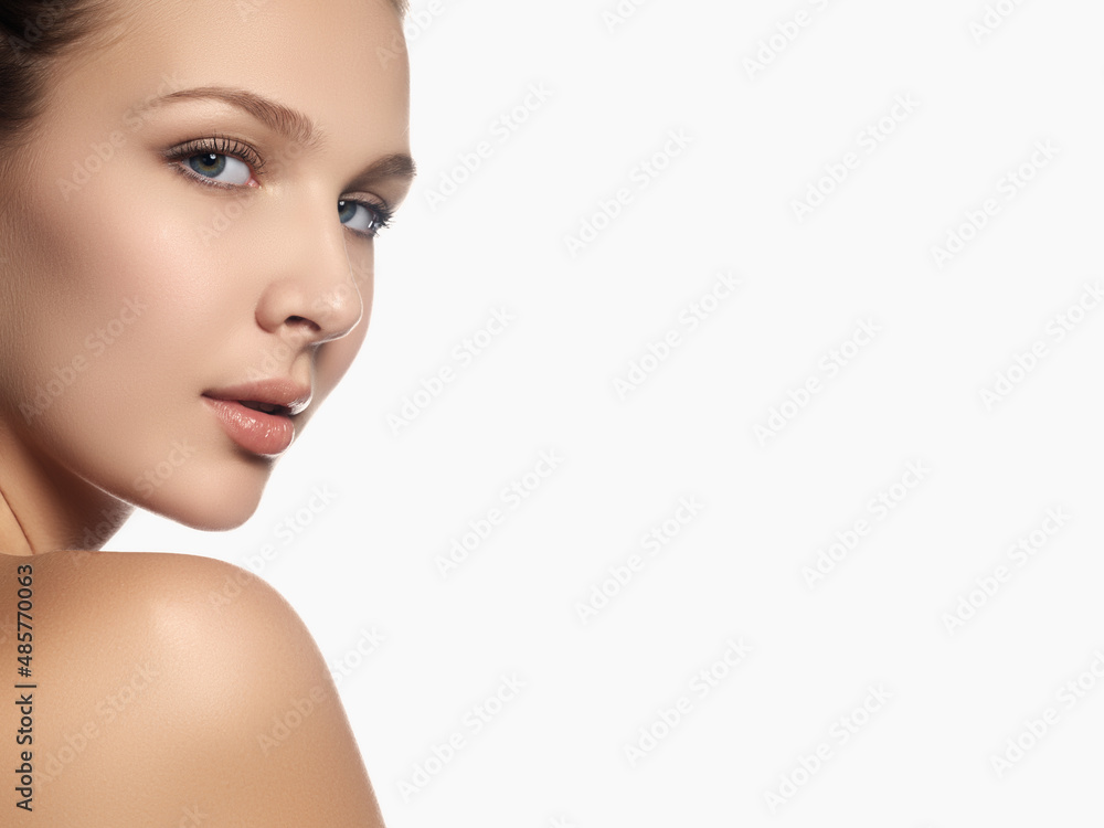 Portrait of beautiful young woman with clean face. High key. Beauty girl. Portrait of beautiful young woman looking at camera. Isolated on white background. Fresh clean skin Portrait of beautiful young woman with clean face. High key. Beauty girl. Portrait of beautiful young woman looking at camera. Isolated on white background. Fresh clean skin