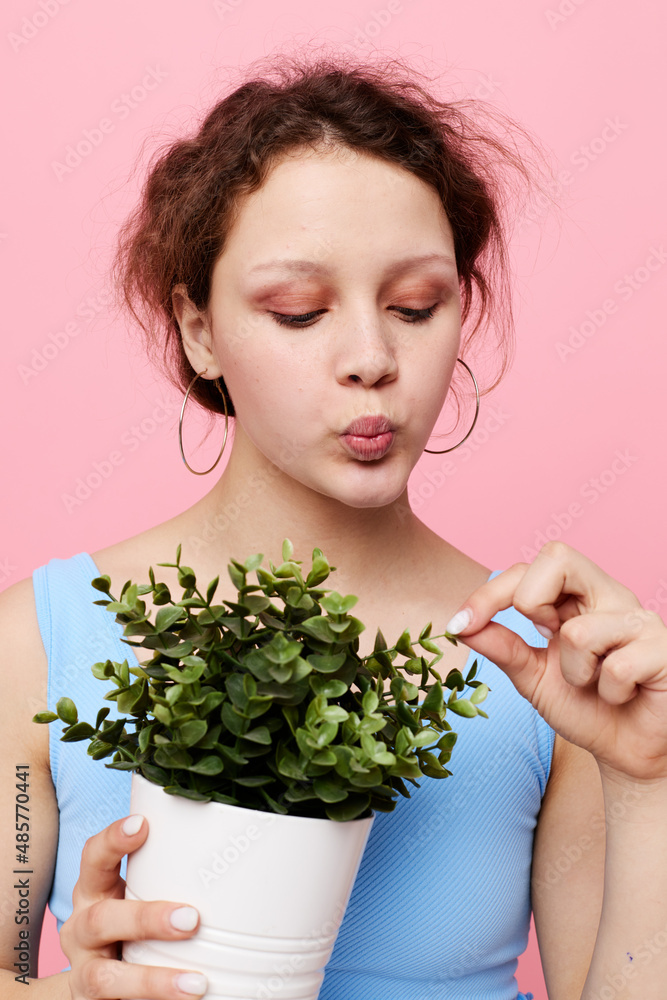 pretty woman flower in white pot posing emotion pink background unaltered pretty woman flower in white pot posing emotion pink background unaltered