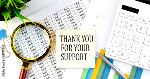 thank you for your support text on sticker on diagram with magnifier and calculator. Business concept