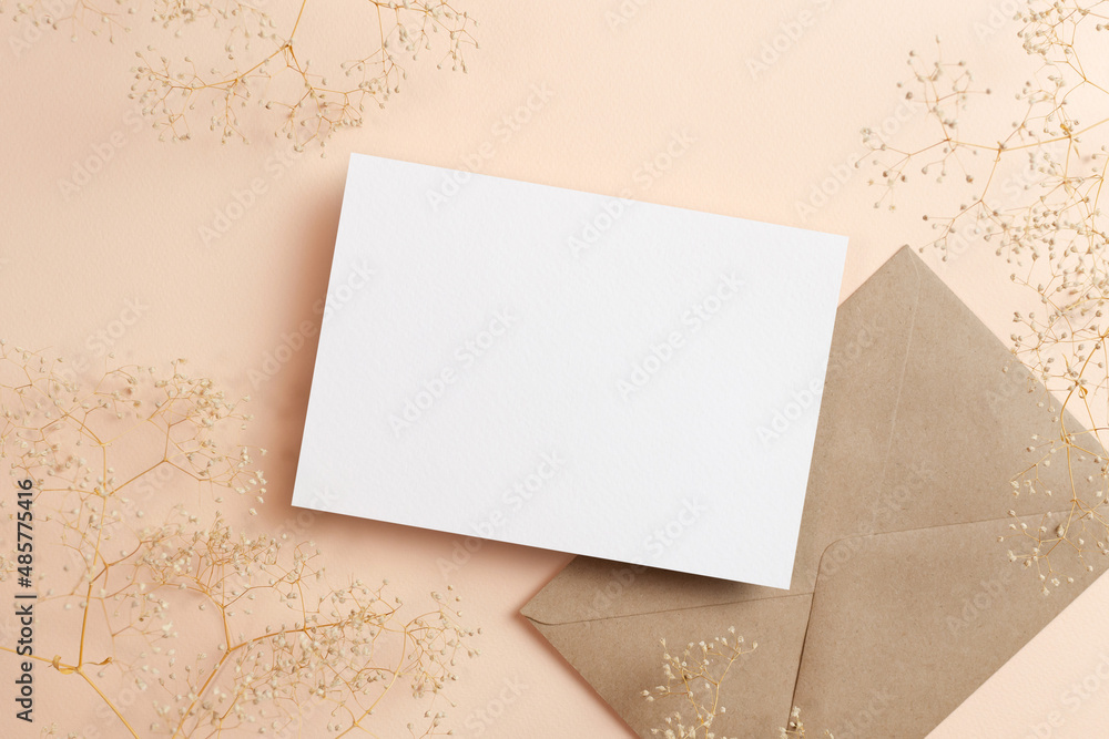 Invitation or greeting card mockup with envelope and dry gypsophila flowers
