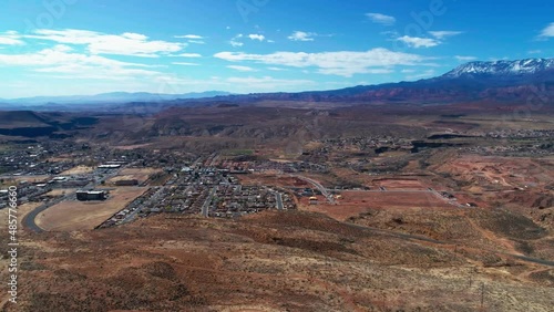 Aerial drone shot over a cliff of the city of Hurricane, Utah. photo