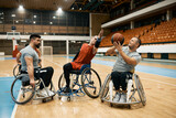 Group of wheelchair-bound players playing basketball match on sports court.