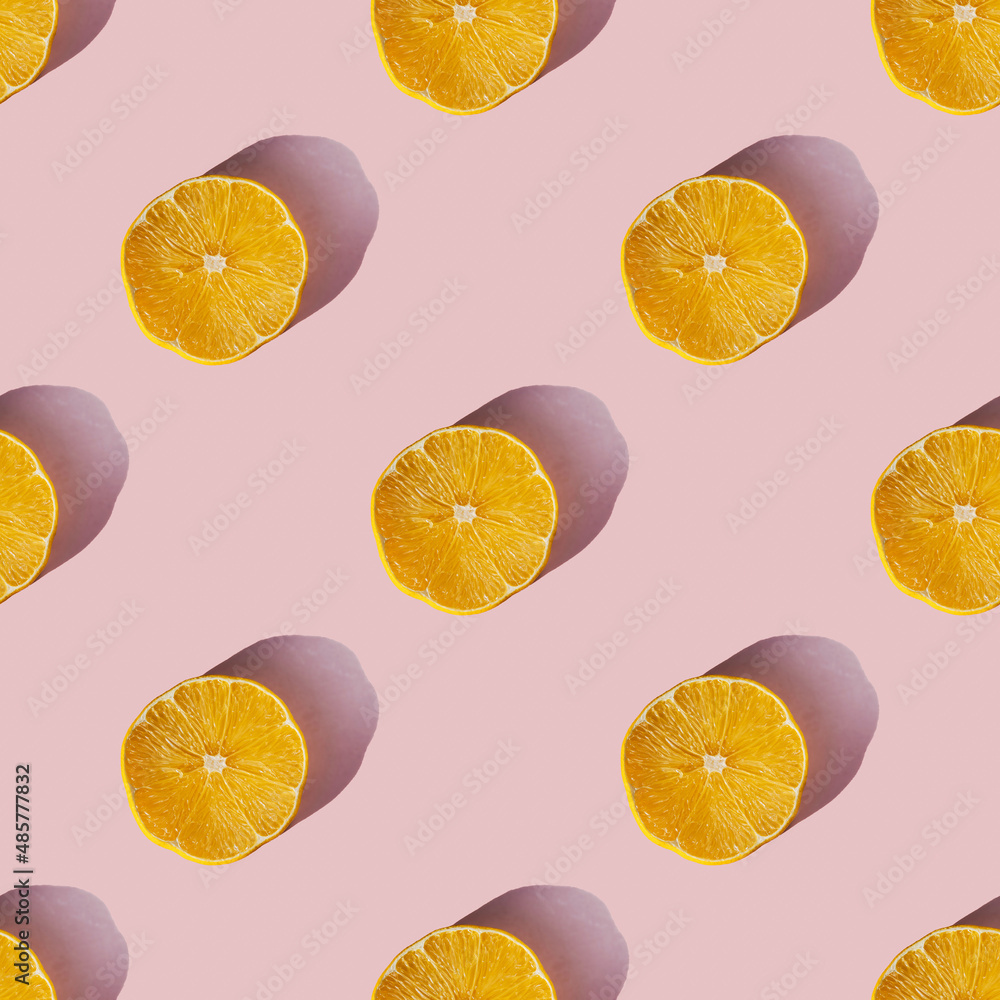 Uniform pattern of dried lemon slices with shadow on a pink background. Flat lay - obrazy, fototapety, plakaty 