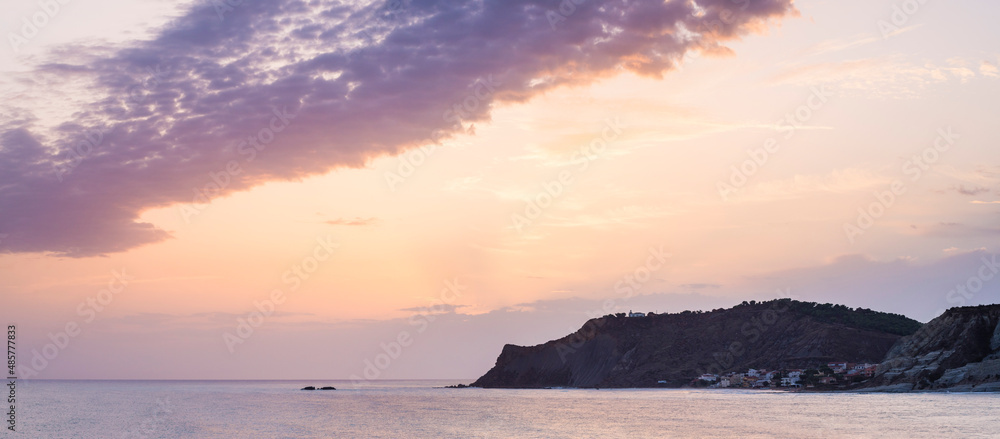 Sunset in Sicily, Panoramic photo of Rossello Cape lighthouse seen from Scala dei Turchi, Realmonte, Agrigento, Sicily, Italy, Europe