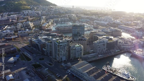 Aerial footage high above Cape Town's marina district at sunset