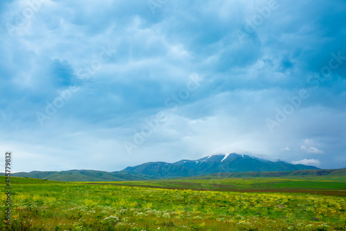 Panoramic view of the mountains in the distance  blue storm clouds over the mountains  cyclone  storm warning. Beautiful nature landscape. The freshness of the mountain air.
