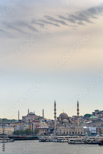New Mosque (Yeni Cami) at sunset with Hagia Sophia (Aya Sofya) behind seen across the Golden Horn, Istanbul, Turkey, Eastern Europe