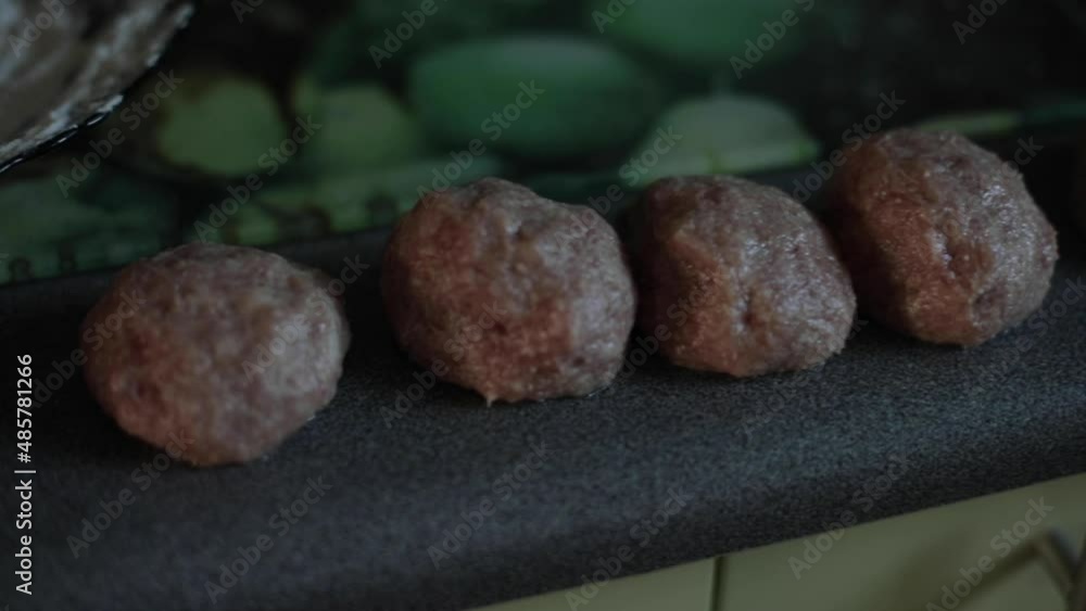 fresh cutlets are fried in a frying pan. Women's hands fry cutlets. A housewife woman cooks delicious cutlets fresh cutlets are fried in a frying pan. Women's hands fry cutlets. A housewife woman cooks delicious cutlets