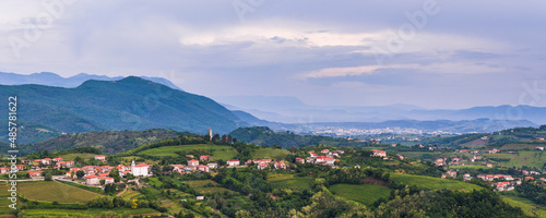 Vineyards and  the hill top town of Kojsko, Goriska Brda (Gorizia Hills), in Brda, the wine region of Slovenia, Europe photo