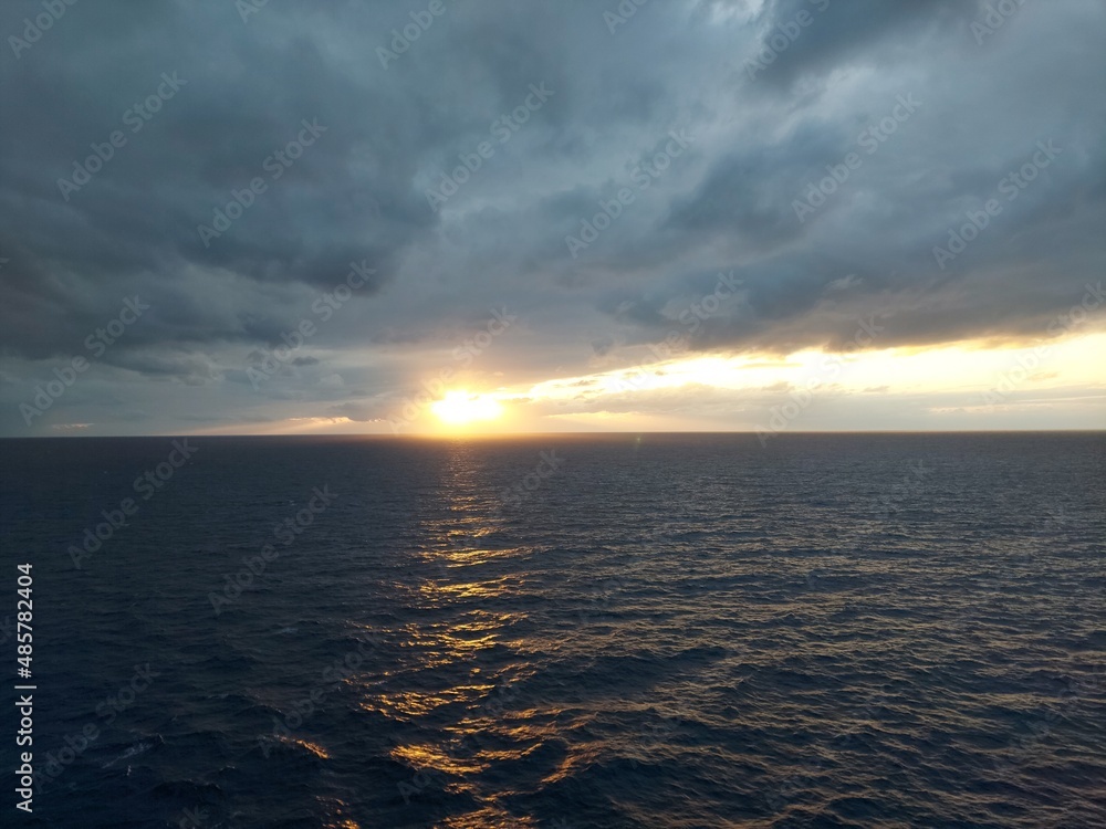 golden sunset and cloudy sky ,view from a cruise ship