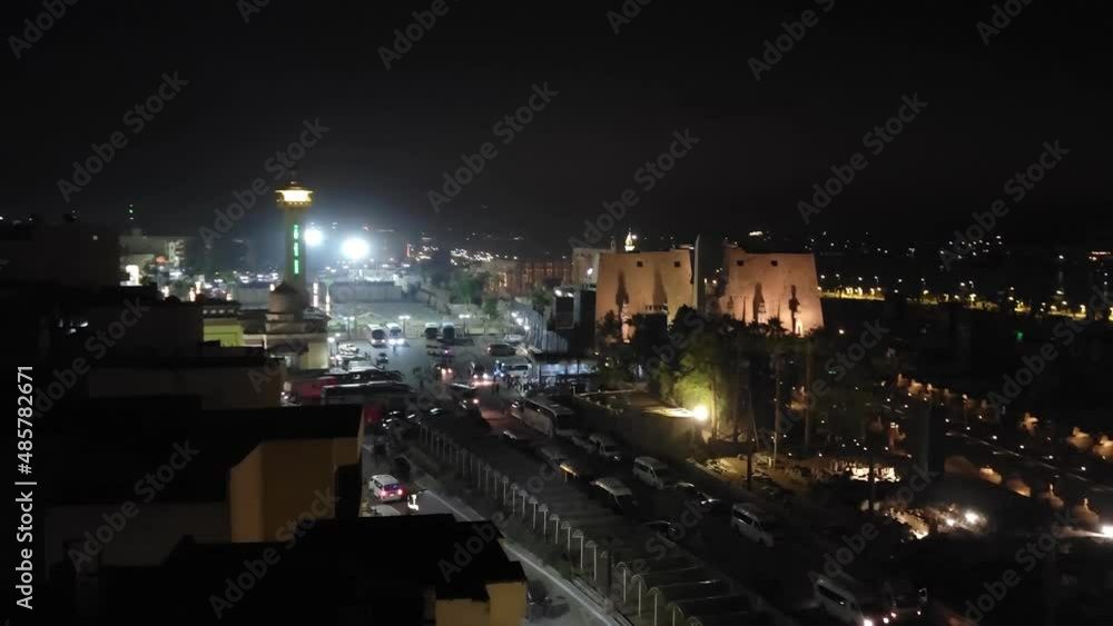 Luxor, Egypt: Nile embankment with boats and Luxor Temple in Luxor, beautiful night landscape, Egypt. Luxor, Egypt: Nile embankment with boats and Luxor Temple in Luxor, beautiful night landscape, Egypt.