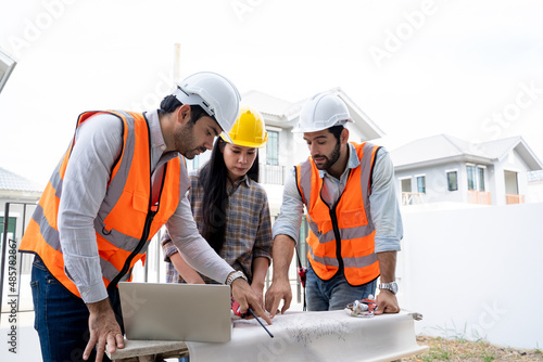 Engineers and woman architect working and reading instruction meeting for project and working on a building site.