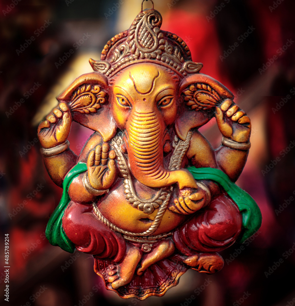 Fototapeta premium Ganesha statue on display with blurred background