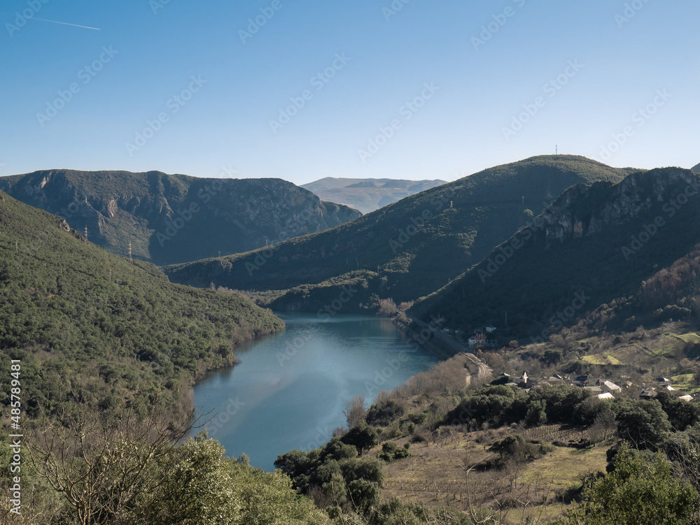 View of the Serra da Encina da Lastra natural park, the Penarrubia reservoir surrounded by mountains and the Covas train station next to the town of Cobas de Valdeorras
