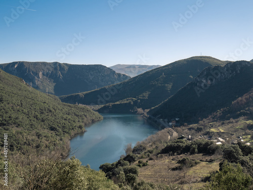 View of the Serra da Encina da Lastra natural park, the Penarrubia reservoir surrounded by mountains and the Covas train station next to the town of Cobas de Valdeorras