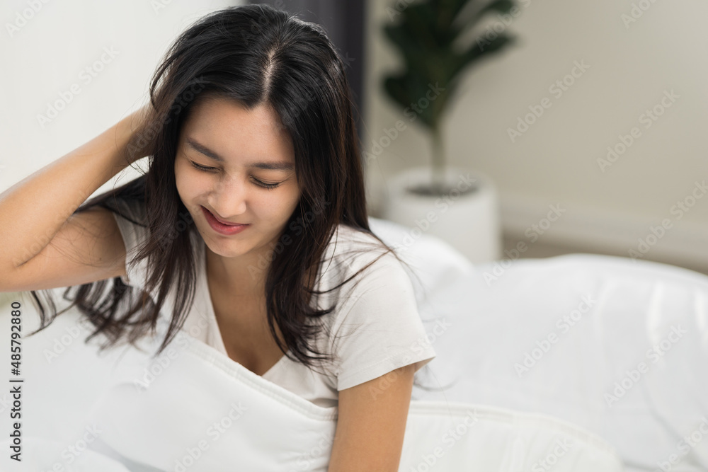 Waking up with a headache. Beautiful woman can't fall asleep moving restless on bed. Young woman having bad dream sleep troubles trying can not sleep. Waking up with a headache. Beautiful woman can't fall asleep moving restless on bed. Young woman having bad dream sleep troubles trying can not sleep.