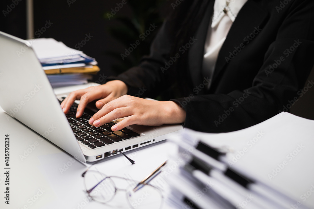 Close up hand woman texting on keyboard laptop work sitting working in office. Close up hand woman texting on keyboard laptop work sitting working in office.