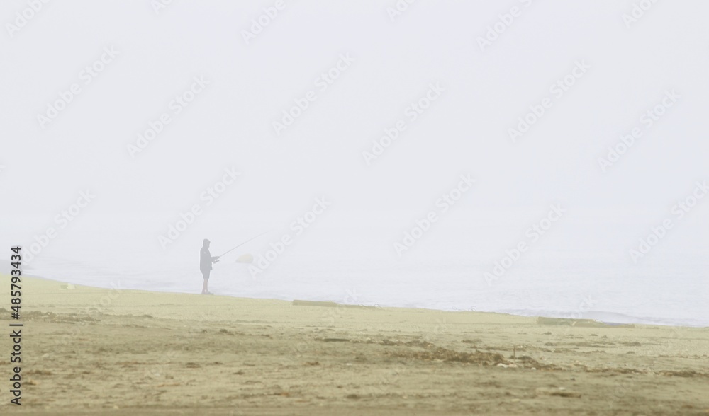 Photograph of fisherman in the morning mist. the beach of the Natural Park of Cabo de Gata, Almería, Andalusia, spain, tourism, tourist, advertising, travel, traveler, holidays, party, meet, tourist Photograph of fisherman in the morning mist. the beach of the Natural Park of Cabo de Gata, Almería, Andalusia, spain, tourism, tourist, advertising, travel, traveler, holidays, party, meet, tourist