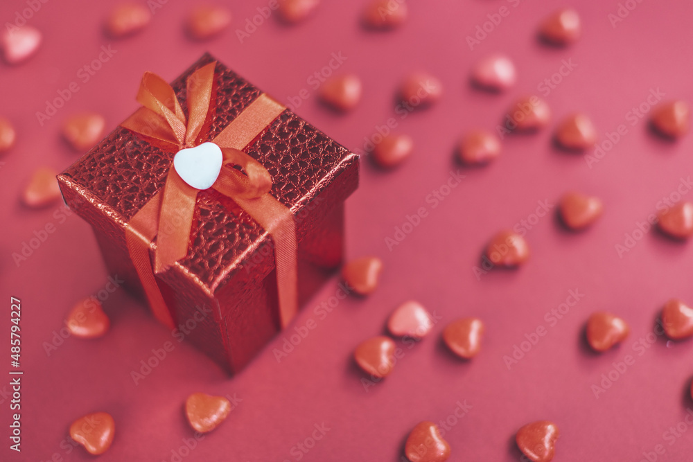 red gift box on the background of hearts for Valentine's Day red gift box on the background of hearts for Valentine's Day