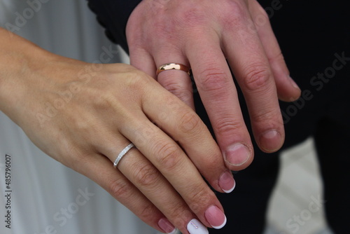 wedding rings on the hands of men and girls