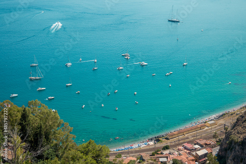 High view of turquoise Mediterranean sea in Taormina, Sicily, Italy during a summer day