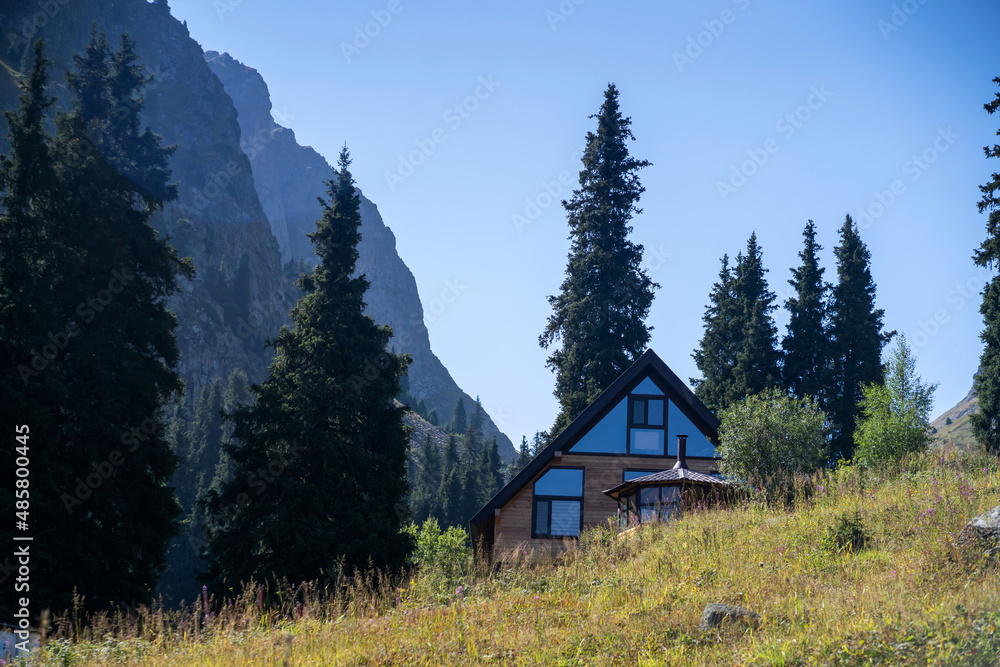 Small pretty house among the mountains.
