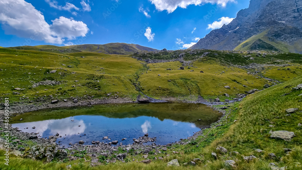 Colorful Abudelauri mountain lakes and hills in the Greater Caucasus Mountain Range in Georgia,Kazbegi Region. Trekking and outdoor travel in mountainous areas.Alpine pastures.Backpacking and trekking