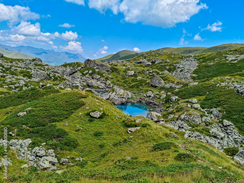 Colorful Abudelauri mountain lakes and hills in the Greater Caucasus Mountain Range in Georgia,Kazbegi Region. Trekking and outdoor travel in mountainous areas.Reflection in the lake