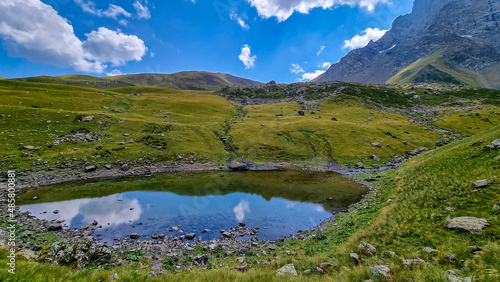 Colorful Abudelauri mountain lakes and hills in the Greater Caucasus Mountain Range in Georgia,Kazbegi Region. Trekking and outdoor travel in mountainous areas.Alpine pastures.Backpacking and trekking