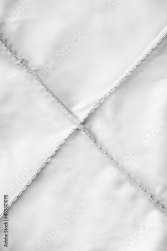 Stitched fabric background © Tarzhanova