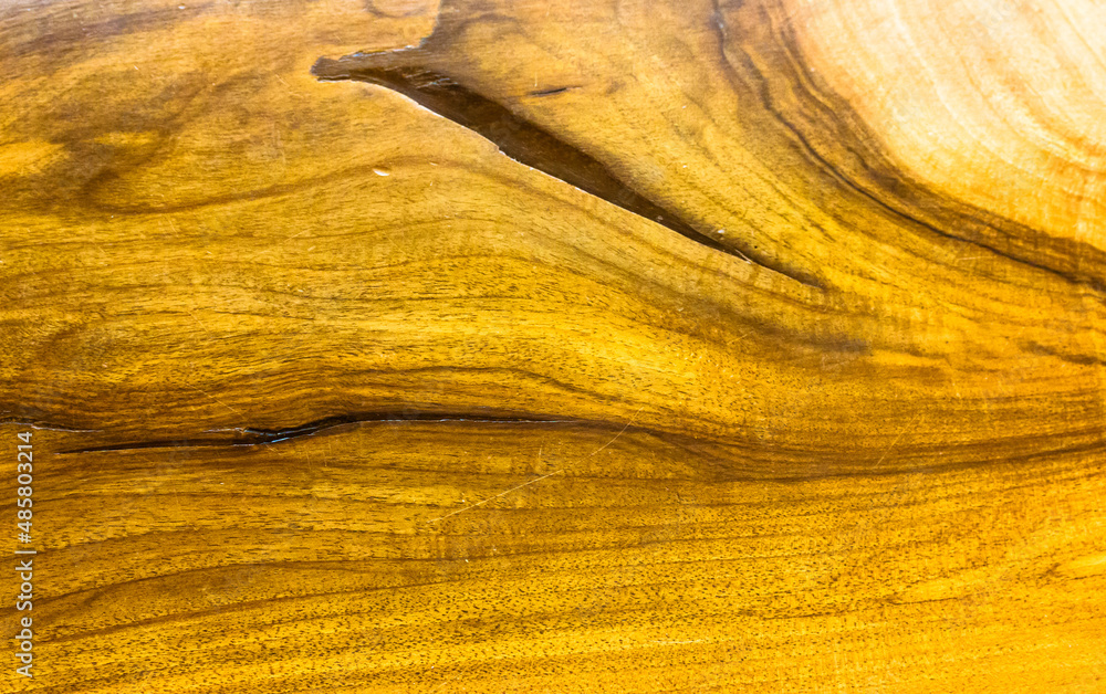 Naklejka premium Wood surface with deep cracks backgrounds, textures top view. Brown tabletop, wall, parquet floor board in modern interior. Unpainted natural wooden furniture. Curving lines of a trunk. Rough timber.
