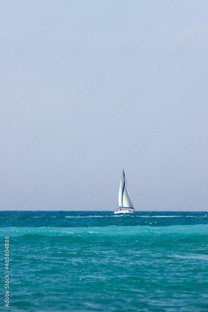 White yacht with sail in Mediterranean Sea