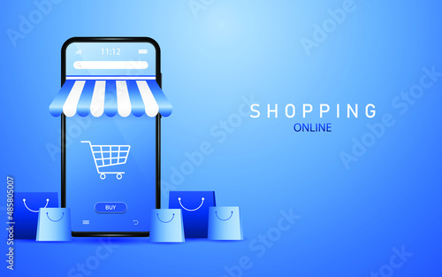 Online shopping on smartphone with shopping cart icon on screen with shopping bags lying around on blue background.
