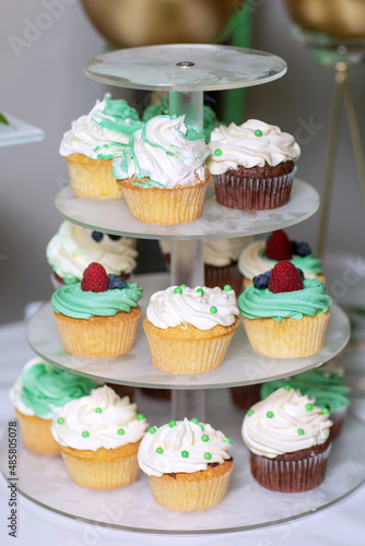 Tasty sweet cupcake on stand, closeup.